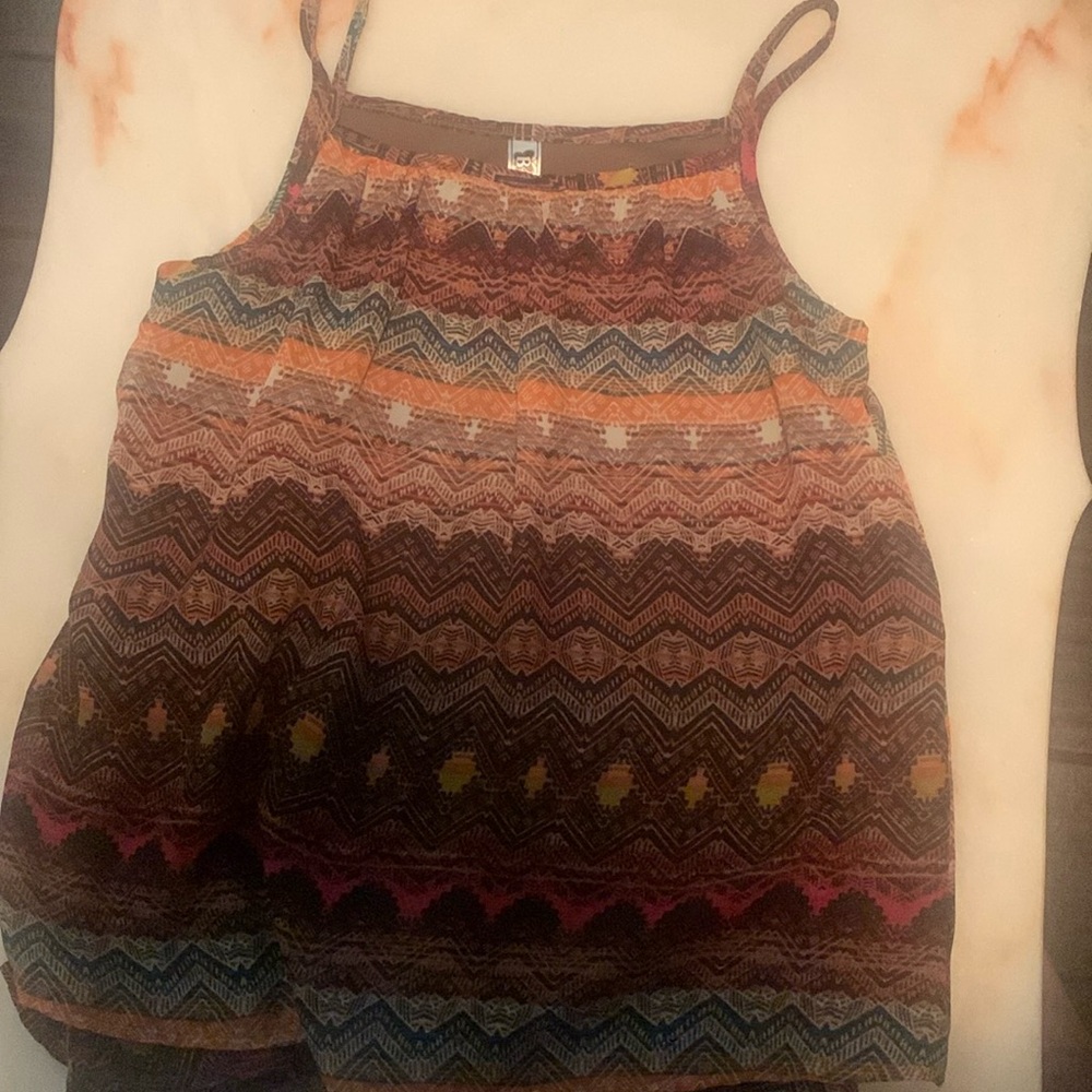 I am selling a cute vintage multicolor sleeveless blouse perfect for summer!!